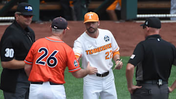 Tennessee Volunteers head coach Tony Vitello and Virginia Cavaliers head coach Brian O'Connor meet before the game at TD Ameritrade Park.