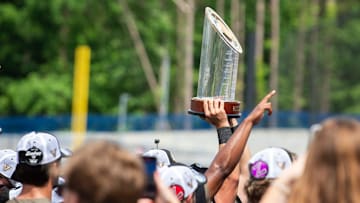 Vanderbilt Commodores players hoist the championship trophy as Ole Miss Rebels take on Vanderbilt Commodores during the SEC baseball tournament championship game at Hoover Met in Birmingham, Ala., on Sunday, May 25, 2025. Vanderbilt Commodores defeated Ole Miss Rebels 3-2.