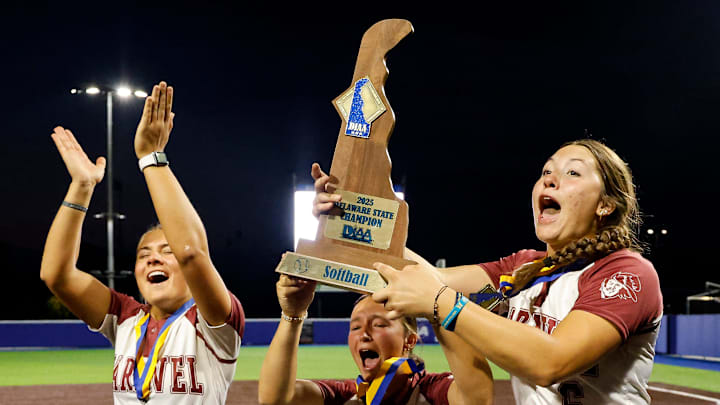 Caravel seniors Peyton Rice (left), Payton Losten and Zayda Rocke celebrate after the Buccaneers won their fifth straight DIAA softball championship with a 3-2 win over Sussex Tech at Delaware Diamond on June 2. Caravel seniors Peyton Rice (left), Payton Losten and Zayda Rocke celebrate after the Buccaneers won their fifth straight DIAA softball championship with a 3-2 win over Sussex Tech at Delaware Diamond on June 2.